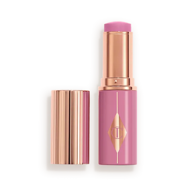 CHARLOTTE TILBURY UNREAL LIP + CHEEK GLOW BLUSH STICK WITH HYALURONIC ACID