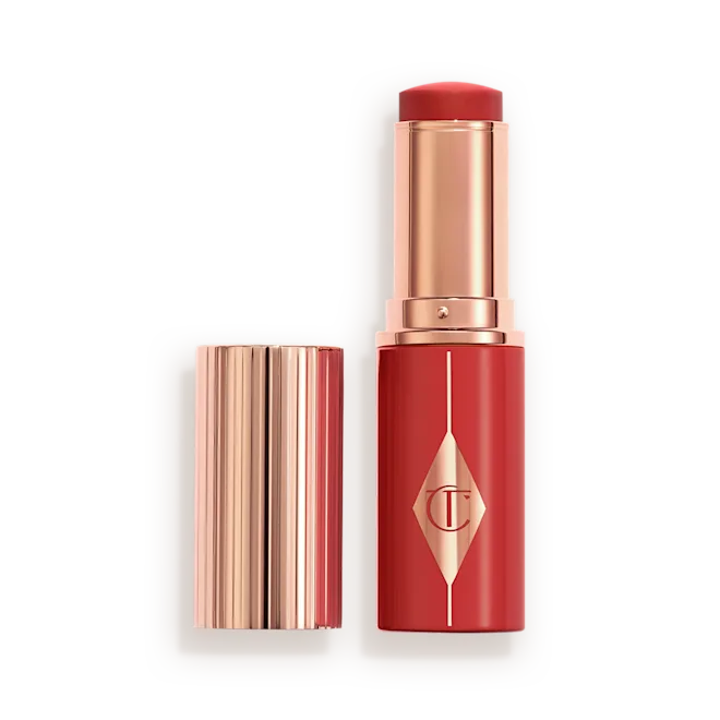CHARLOTTE TILBURY UNREAL LIP + CHEEK GLOW BLUSH STICK WITH HYALURONIC ACID